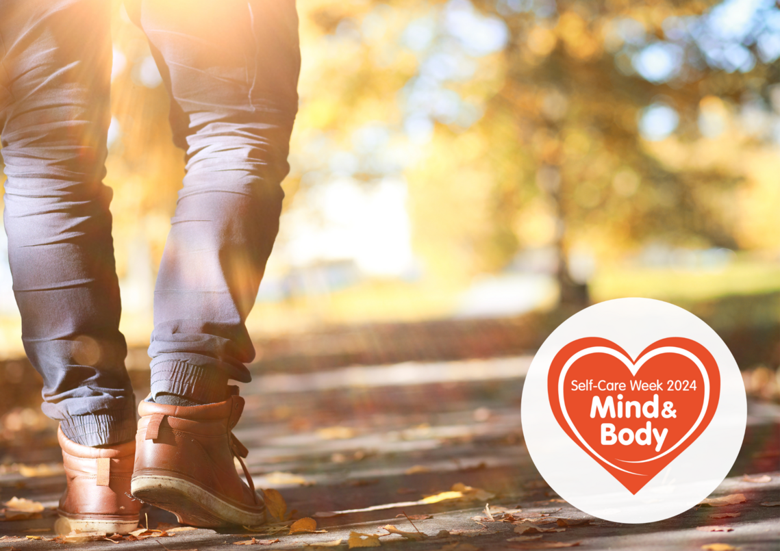 one person's legs and feet walking in autumn 